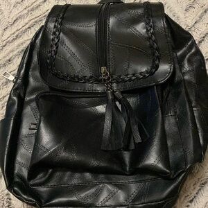 Black stitched up backpack great to keep stuff u need for on the road never used